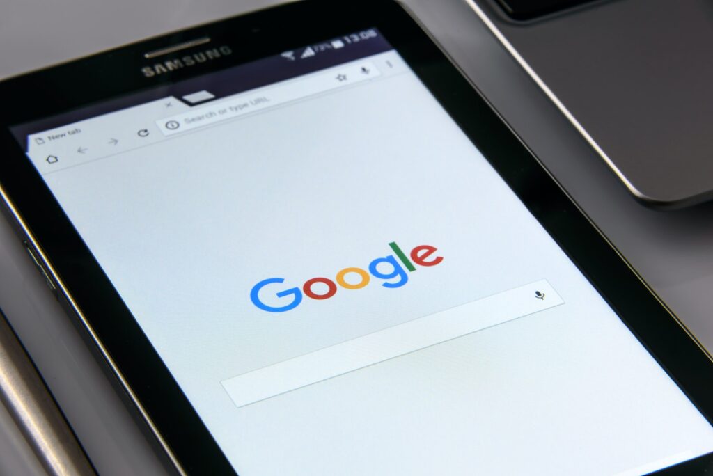 What is Online presence featured image of a tablet showing google search page.